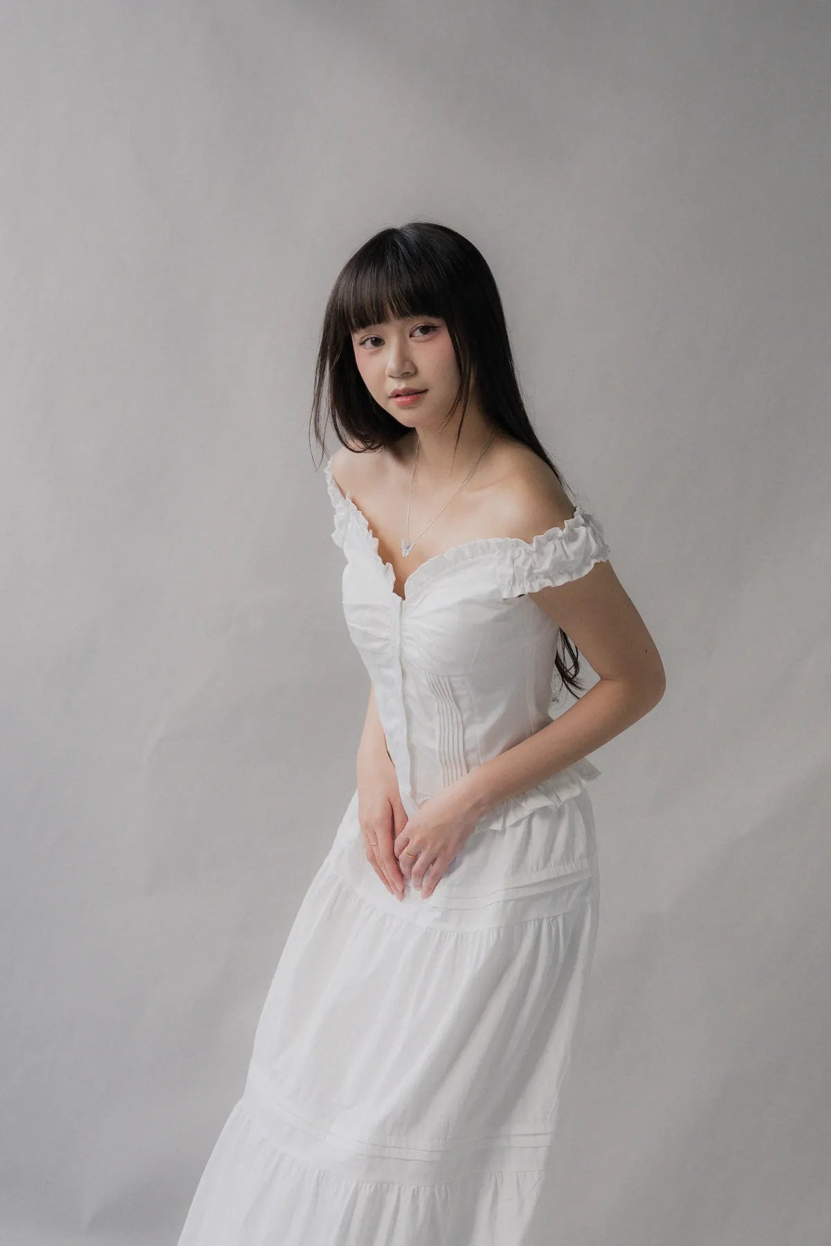 Georgie Pintuck Ruffle Puffed Sleeve Padded Top